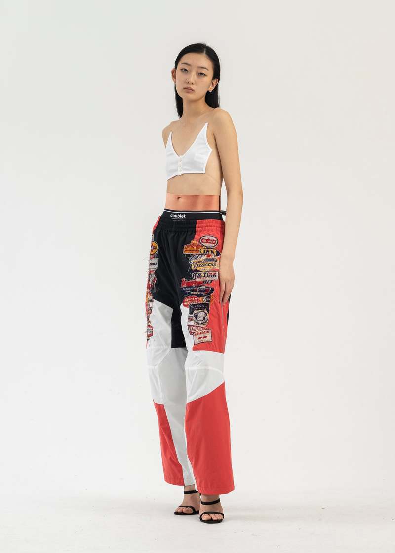 doublet ダブレット A.I. PATCHES TRACK PANTS Doublet A I PATCHES EMBRIDERY TRACK PANTS - BLACK/RED | Garmentory