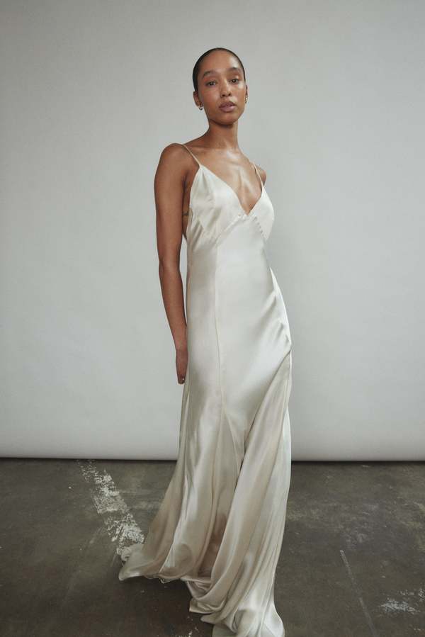 slip dress ivory Leah Easy Satin Maxi skimming silhouette continues to a slip skirt with a chic midi hem Ivory Silk Slip Midi Dress