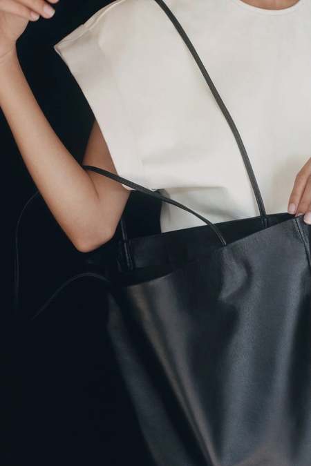 Modern Weaving Slim Lamb Oval Bucket Bag - Ecru/Tan | Garmentory
