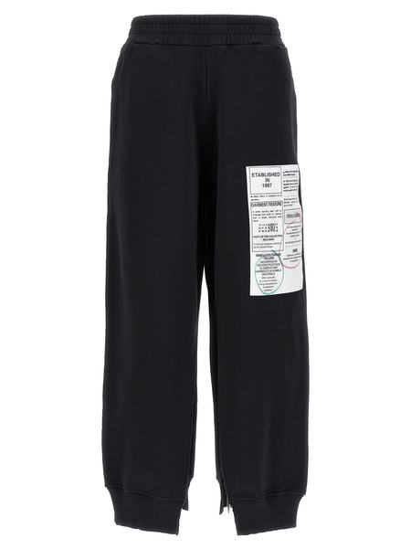 MM6｜TRAINING PANTS (S52KA0502 M25003 900) MM6 MAISON MARGIELA W Black Sweatpants with ruffles at the
