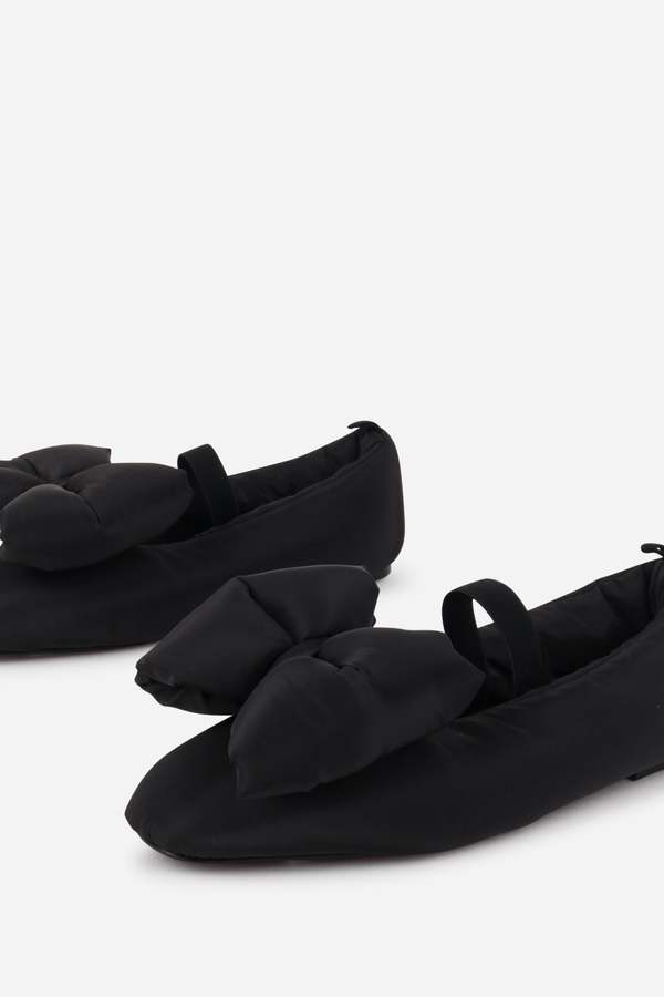 INTENTIONALLY __________. Kor Puffer Mary Jane Flat