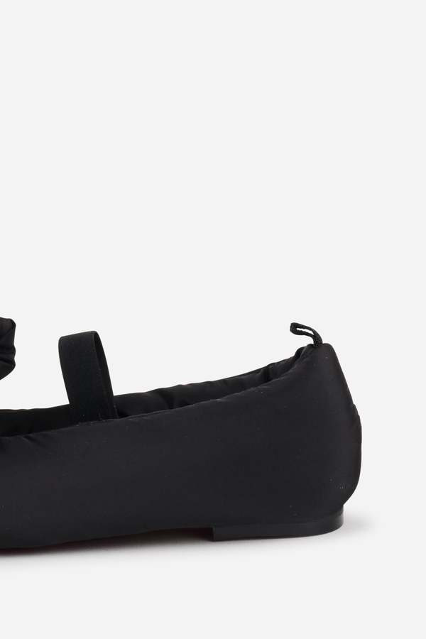 INTENTIONALLY __________. Kor Puffer Mary Jane Flat