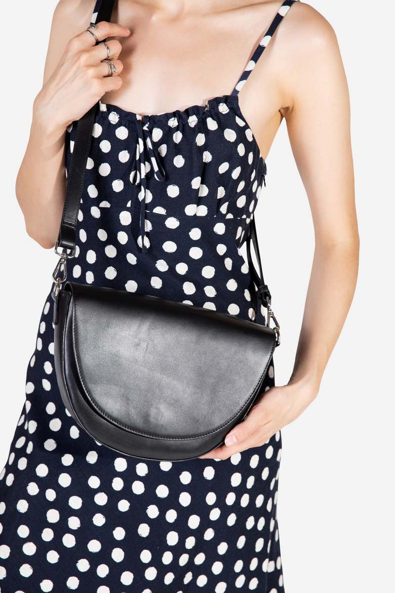 INTENTIONALLY __________. Michigan Half Moon Leather Crossbody Bag - Black