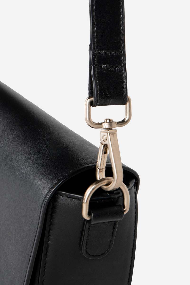 INTENTIONALLY __________. Michigan Half Moon Leather Crossbody Bag - Black