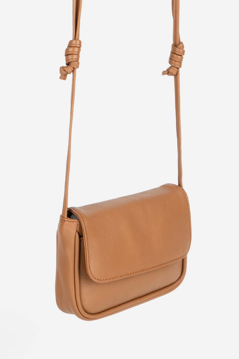 INTENTIONALLY __________. Orleans Leather Mini Crossbody Bag