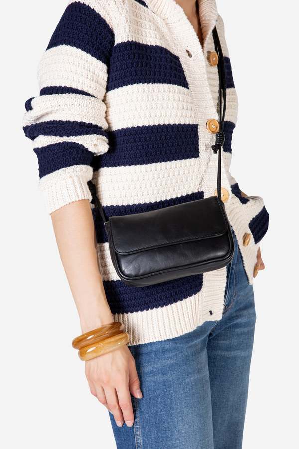 INTENTIONALLY __________. Orleans Leather Mini Crossbody Bag