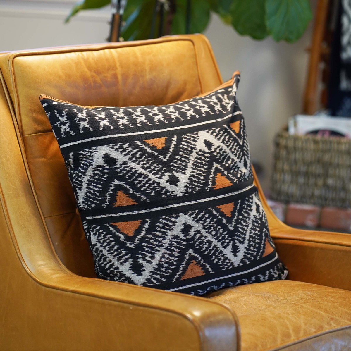 Kasih Coop Handwoven Ikat Pillow Cover - Black and Orange - Image 1 of 7