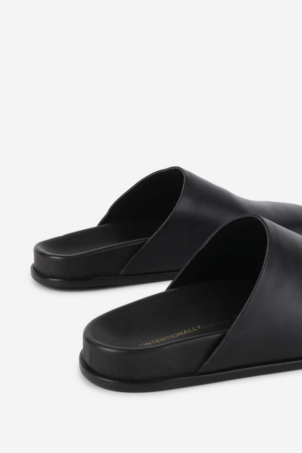 "INTENTIONALLY __________." AGATHA SLIP ON NATURAL SOLE MULE