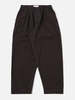 Universal Works Pleated Track Pant in Licorice Canvas Trousers - Thumbnail 1