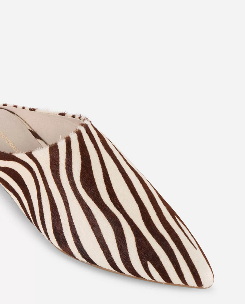INTENTIONALLY __________. Major Cowhide Flat Mule - Beige Zebra