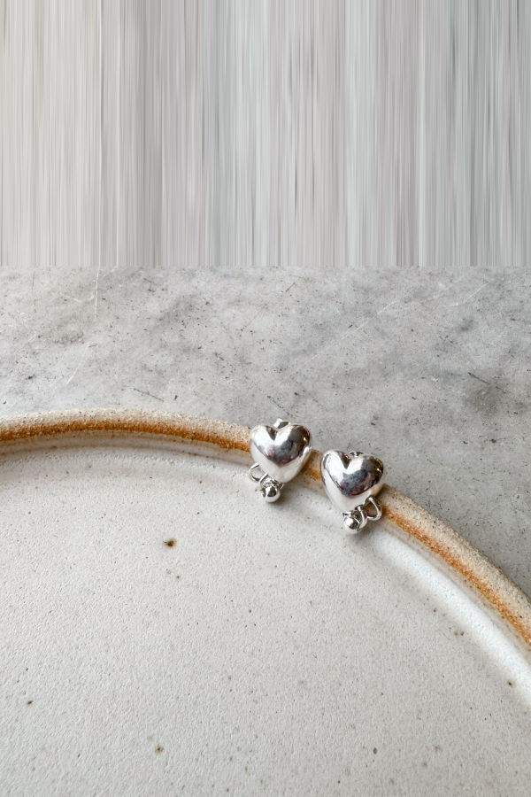 Alma Mercantile Pierced Heart Studs Earrings - Silver