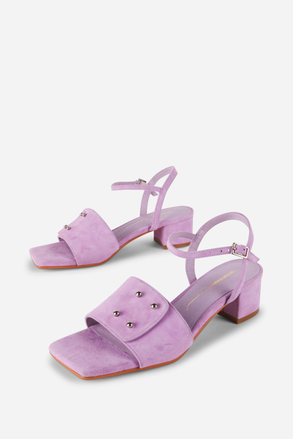 INTENTIONALLY __________. Karizma Block Heel Sandal