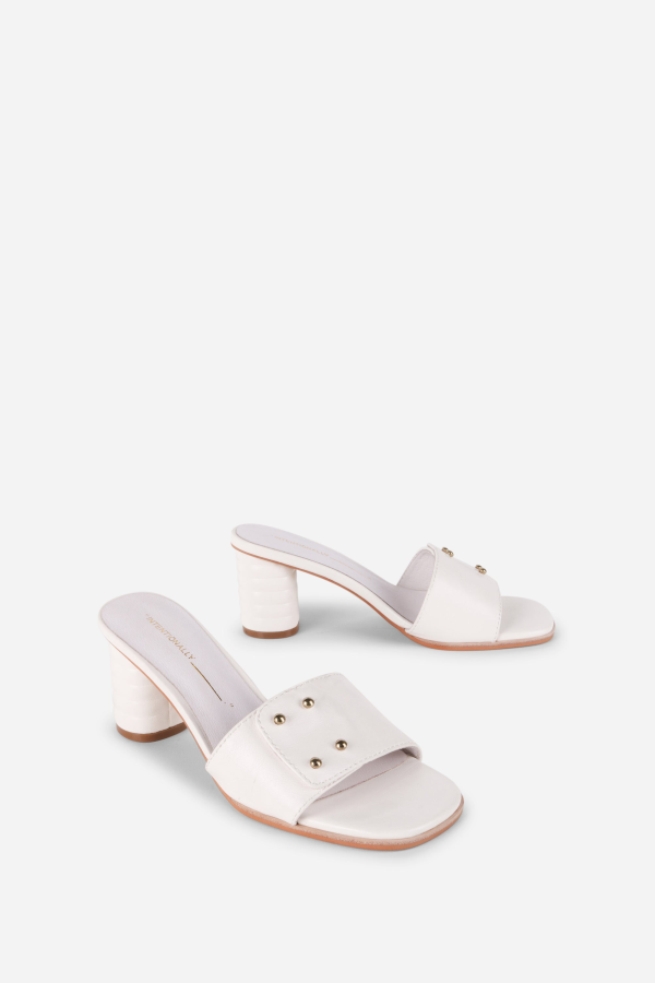 INTENTIONALLY __________. Kizmit Mule Heels