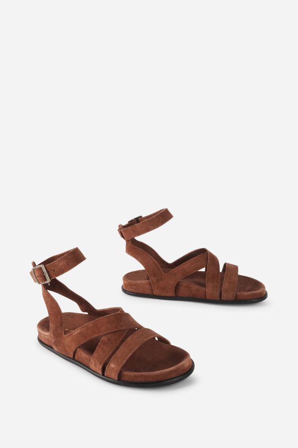 "INTENTIONALLY __________." Myko Ankle Strap Flat Sandal