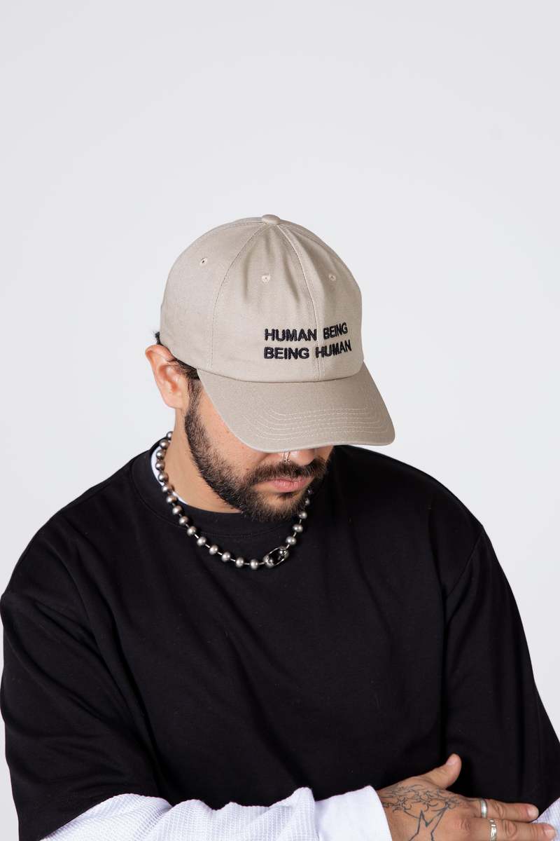 "INTENTIONALLY __________." Human Nature Dad Cap