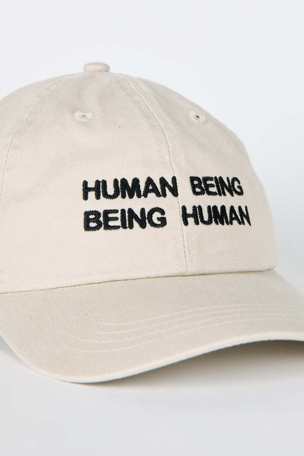 "INTENTIONALLY __________." Human Nature Dad Cap