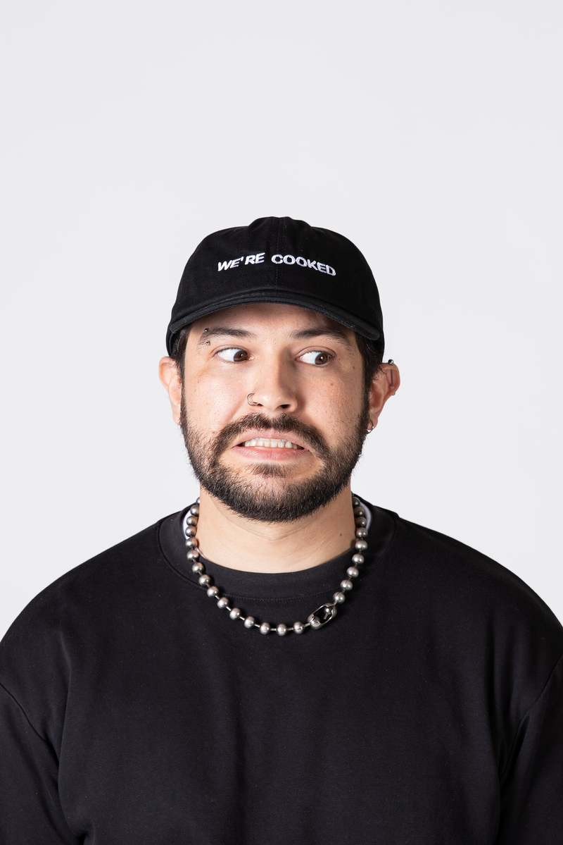 "INTENTIONALLY __________." WE'RE COOKED Dad Cap - Black White