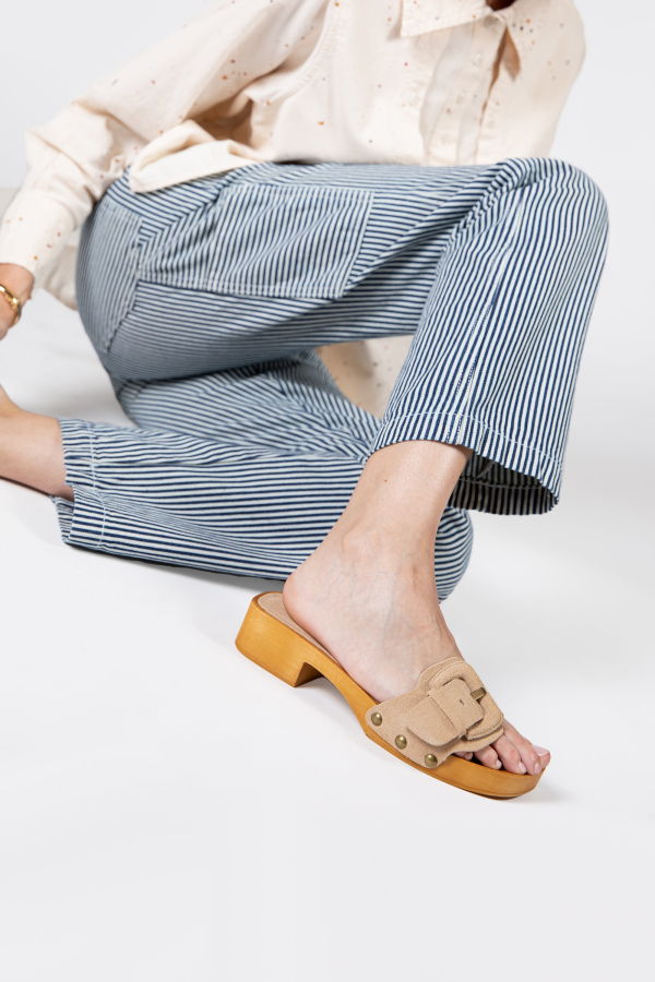 INTENTIONALLY __________. Mar Suede Clog