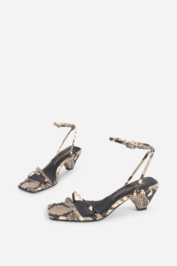 INTENTIONALLY __________. Pretty Please Snake Embossed Heel Sandal - Black White