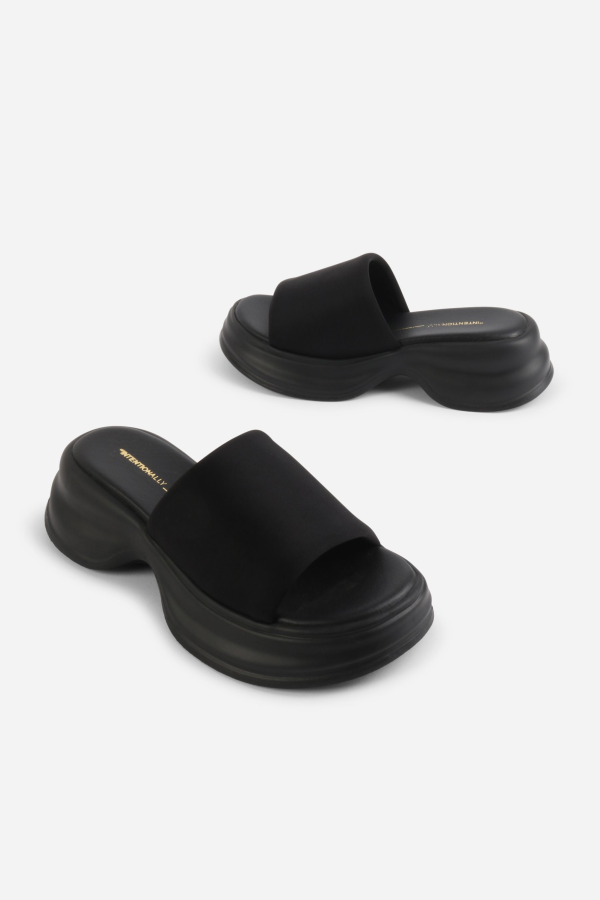 "INTENTIONALLY __________." Murphy Lycra Platform Slide - Black