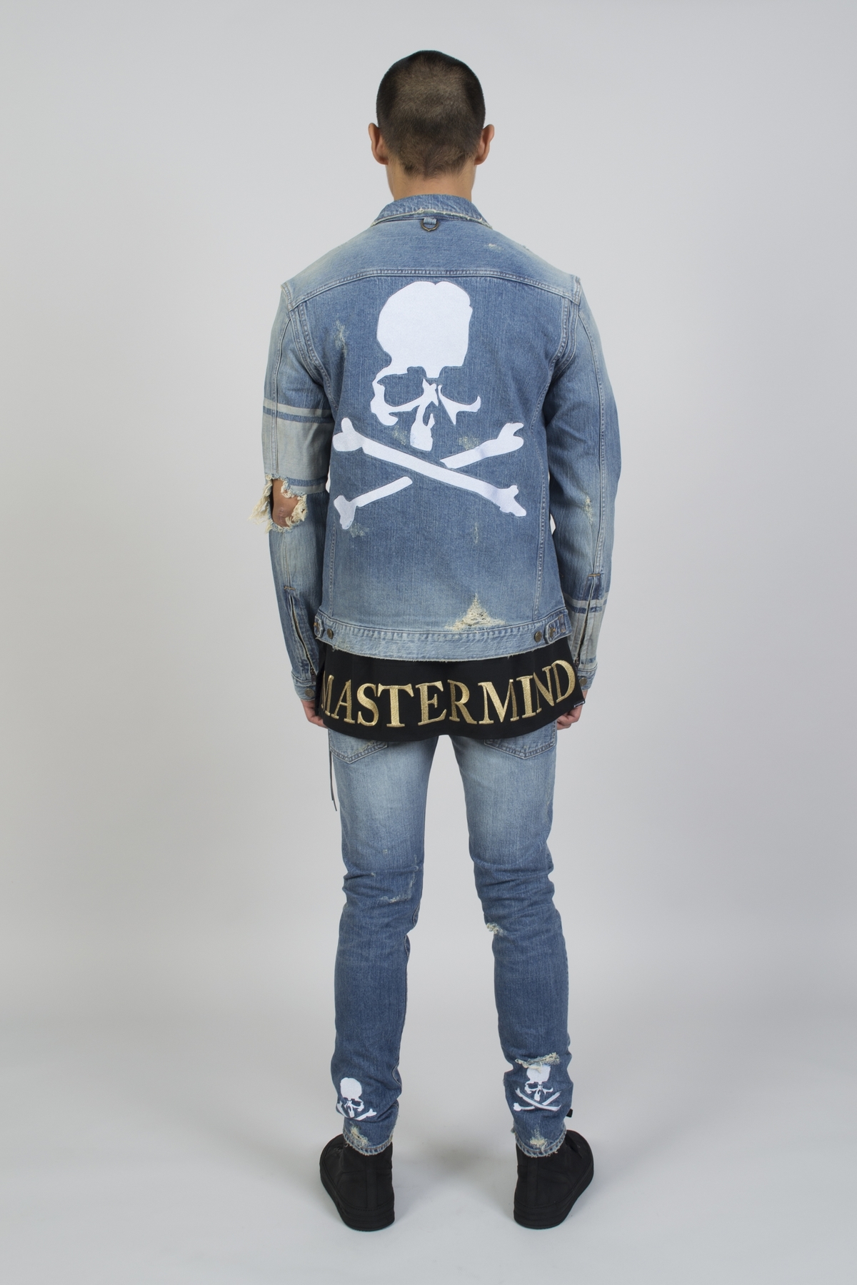 indigo distressed denim jacket with white stitched