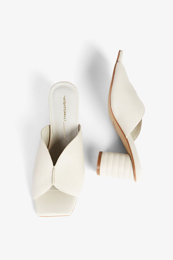 "INTENTIONALLY __________." Kamika Heel - Multi