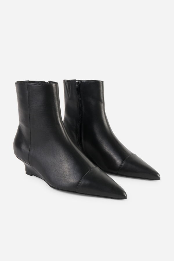 INTENTIONALLY __________. Lexicon Micro Wedge Heel Ankle Boot