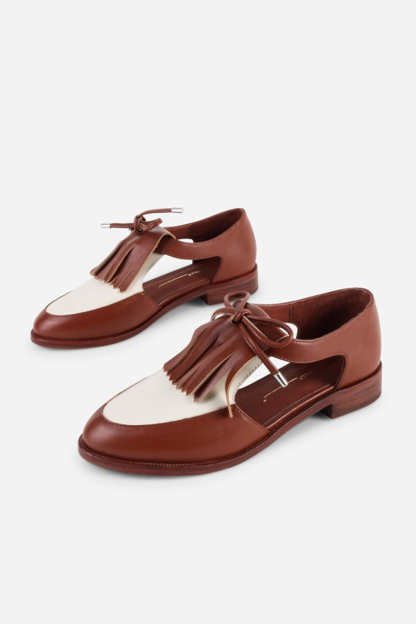 INTENTIONALLY __________. Tock Cutout Tassel Oxford