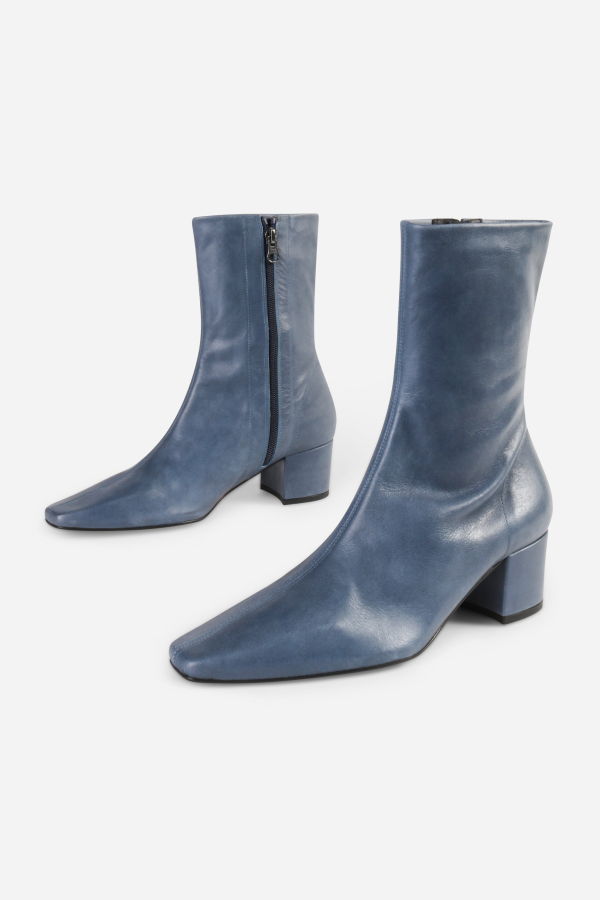 INTENTIONALLY __________. Carlton Boots