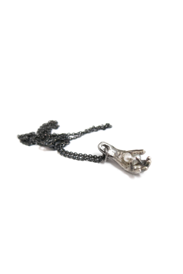 Elaine Ho Hand Holding Pearl Necklace