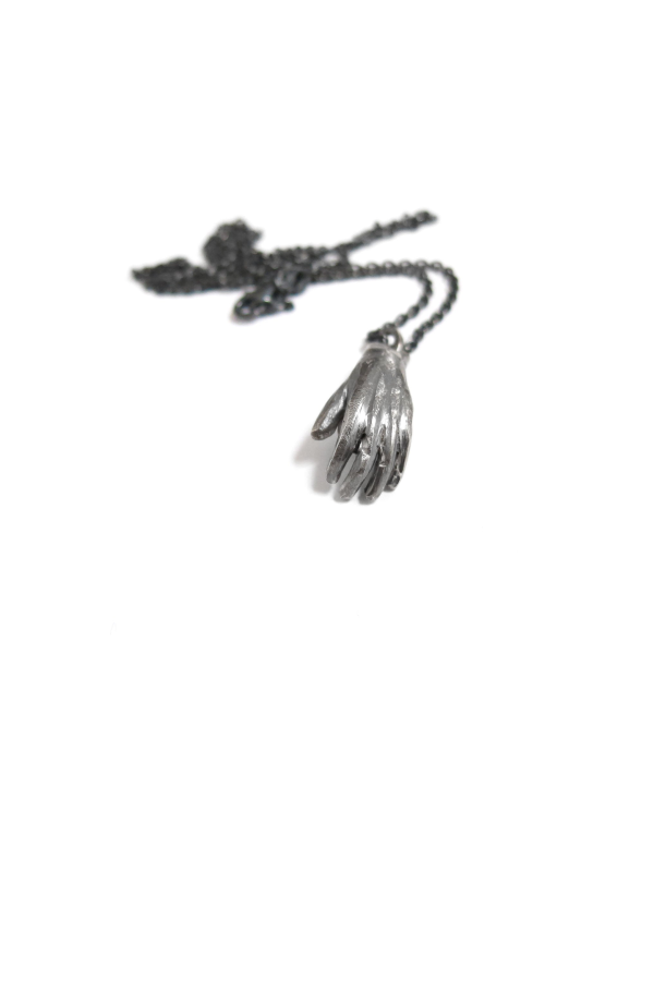 Elaine Ho Hand Holding Pearl Necklace