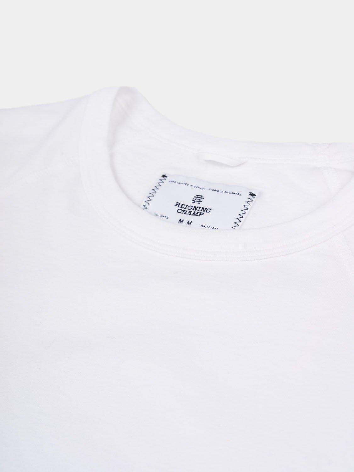 reigning champ raglan tee
