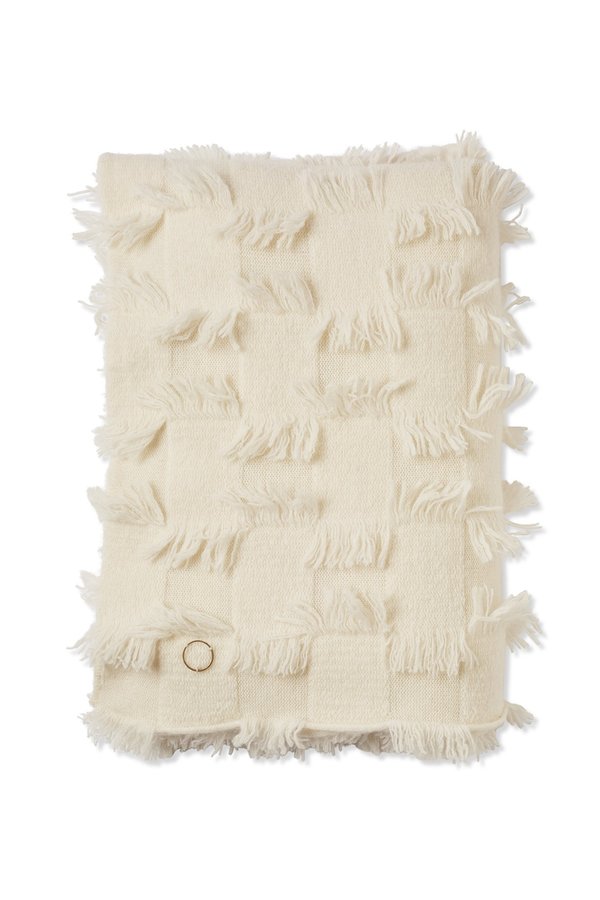 Oyuna Seren Knitted Hand Cut Fringed Cashmere Throw - Ivory Oyuna Seren Knitted Hand Cut Fringed Cashmere Throw - Ivory