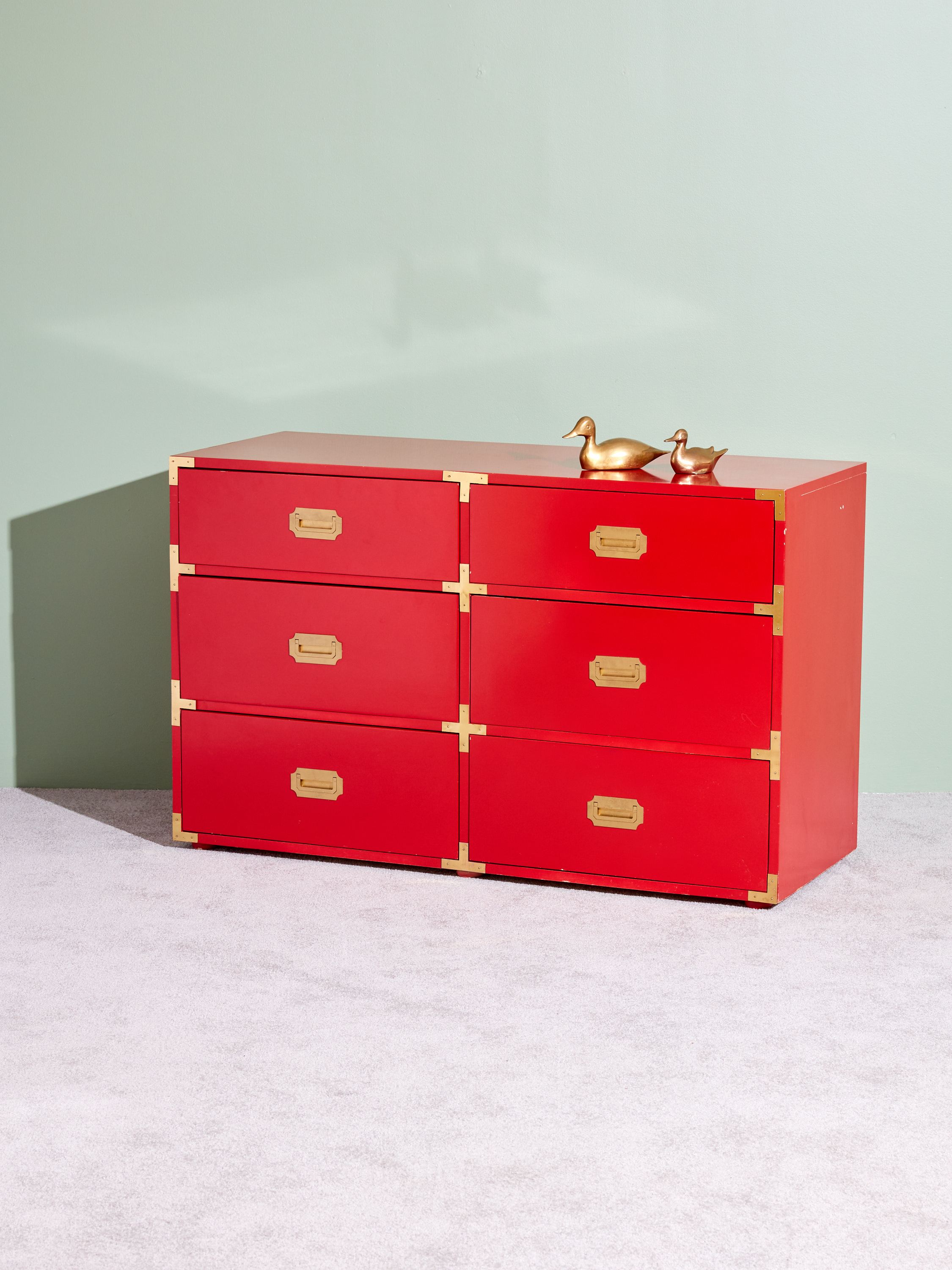 red campaign dresser How To Style A Red Lacquer Campaign Dresser