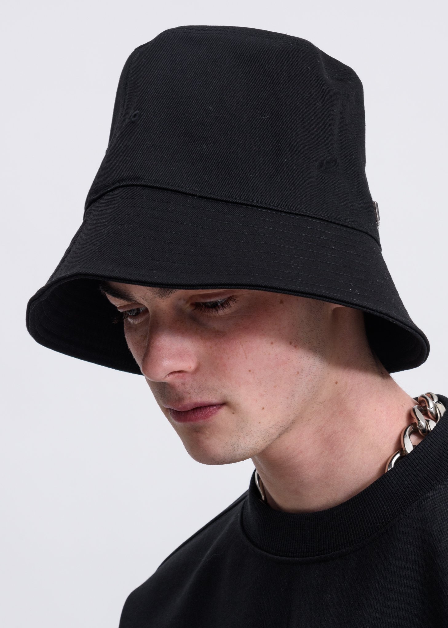 We11done  Metal Logo Bucket Hat in Black. we11done Metal Logo Bucket Hat - Black | Garmentory main image 2