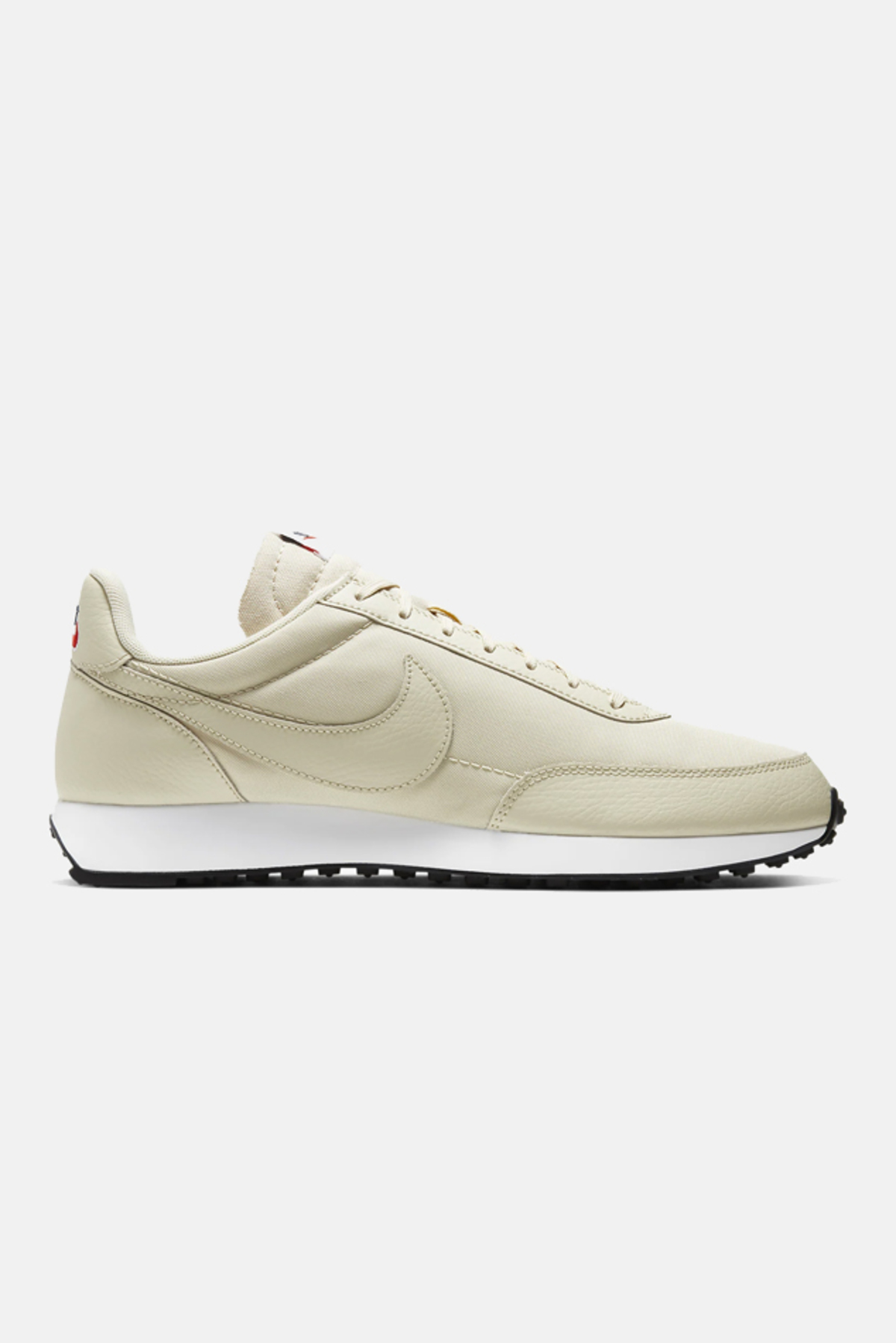 cream nike tailwind