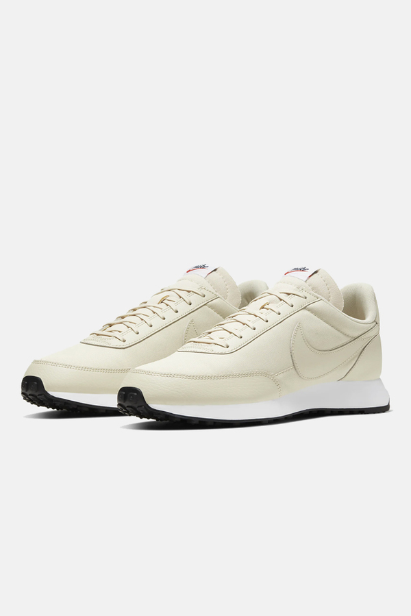 cream nike tailwind