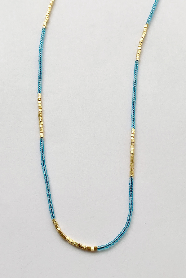 Debbie Fisher Clear Blue Seed with Gold Vermeil Necklace Debbie Fisher Clear Blue Seed with Gold Vermeil Necklace