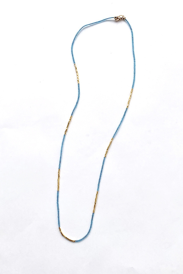Debbie Fisher Clear Blue Seed with Gold Vermeil Necklace Debbie Fisher Clear Blue Seed with Gold Vermeil Necklace