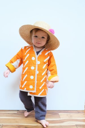 Kids CanDid Art Shapes & Angles Reversible Quilted Coat - Orange Kids CanDid Art Shapes & Angles Reversible Quilted Coat - Orange