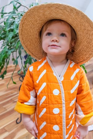 Kids CanDid Art Shapes & Angles Reversible Quilted Coat - Orange Kids CanDid Art Shapes & Angles Reversible Quilted Coat - Orange