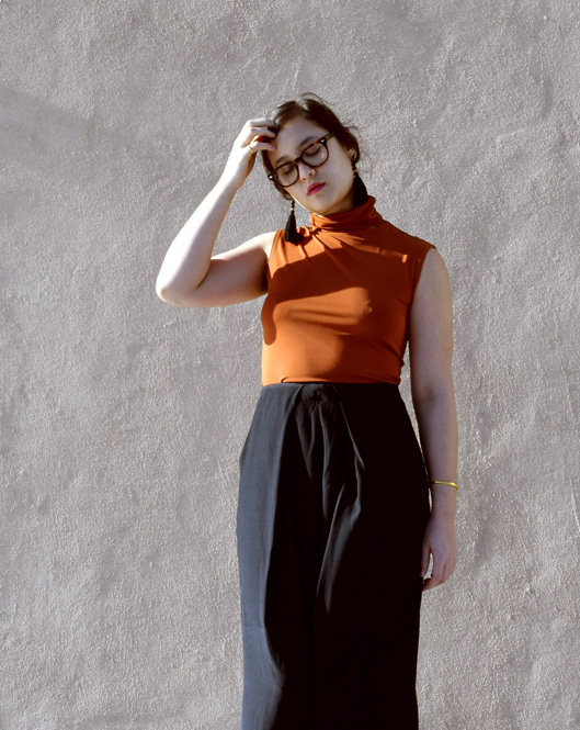 Sleeveless Cut-Out Turtleneck Sleeveless Cut-Out Turtleneck