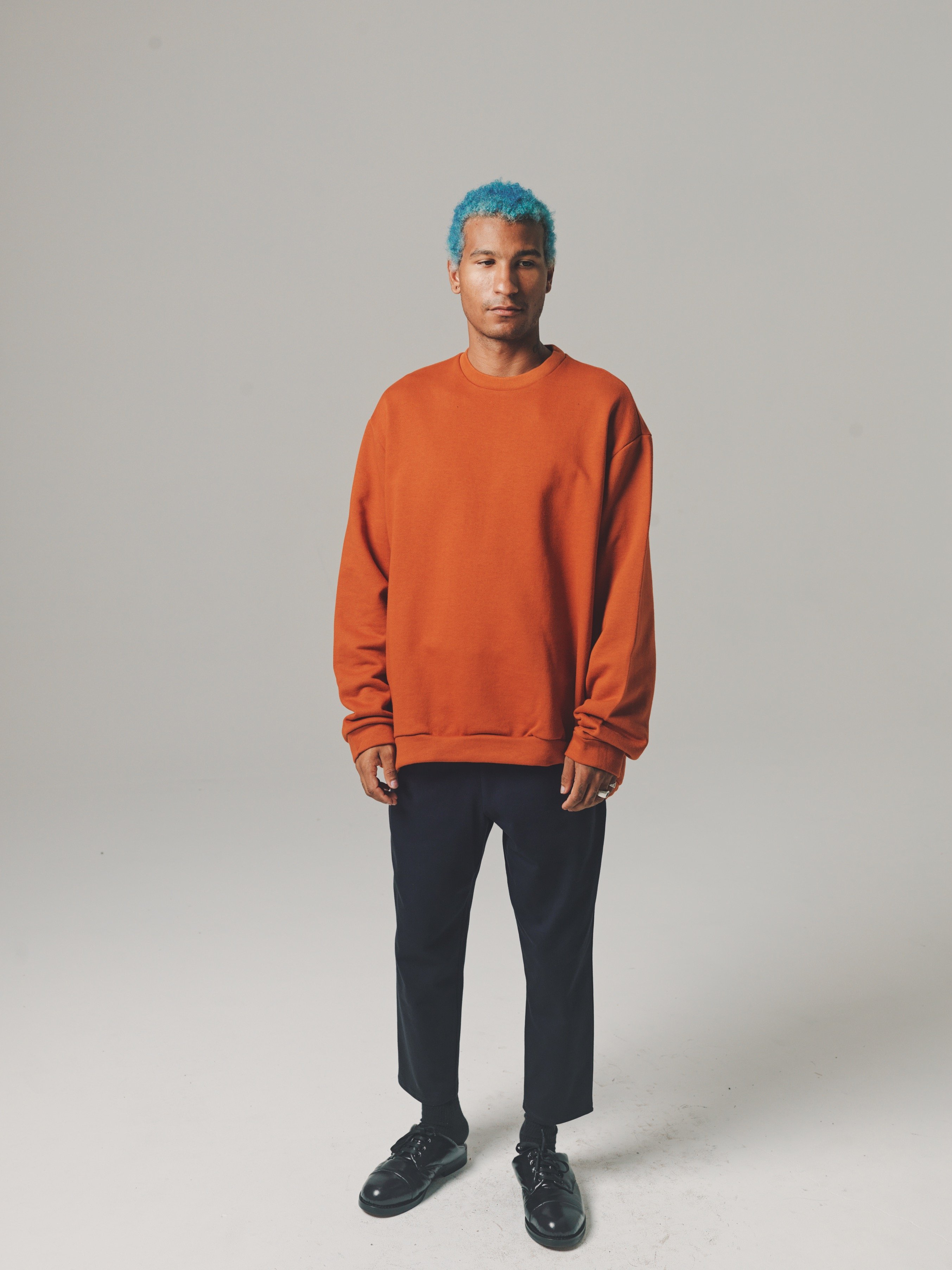oversized orange sweatshirt
