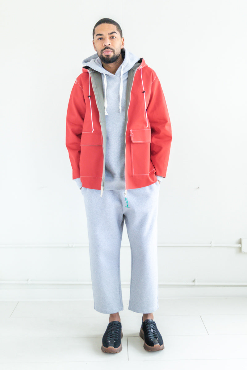 HOODED RAIN JACKET IN RED AND KHAKI | Garmentory