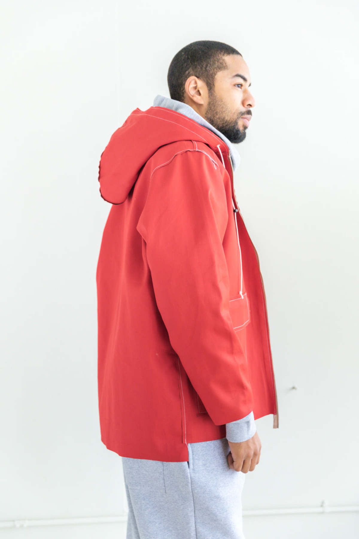 HOODED RAIN JACKET IN RED AND KHAKI | Garmentory