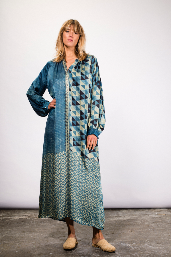 blue ajrak dress An elegant fusion of tradition and craftsmanship, this Ajrak dress is beautifully adorned with intricate gota work that adds a graceful festive charm. Crafted from rich Ajrak-inspired fabric featuring timeless cultural patterns,