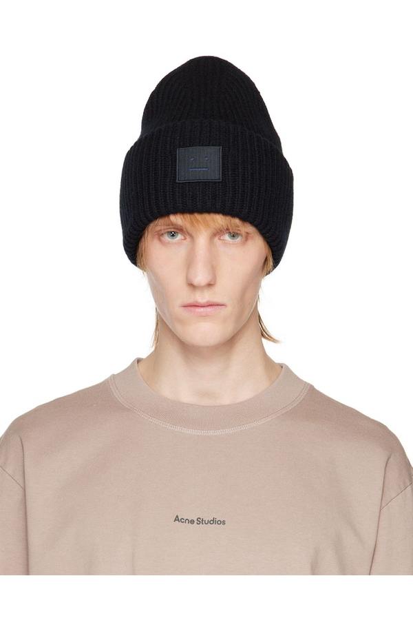 Stay cozy and stylish with this Acne Studios knitted hat.\