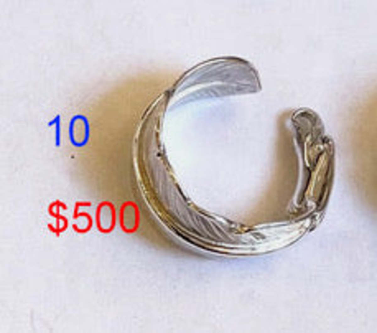 Larry Smith Eagle Head Feather Ring No. 25 | Garmentory