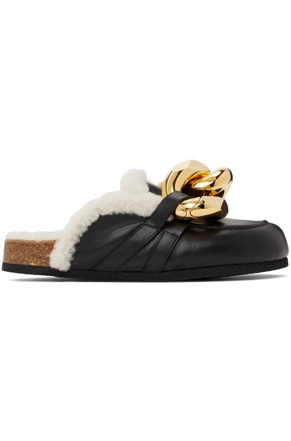 Buffed calfskin slip-on loafers in black. Signature curb chain accent at vamp. JW Anderson Black Chain Loafers JW Anderson main image 3
