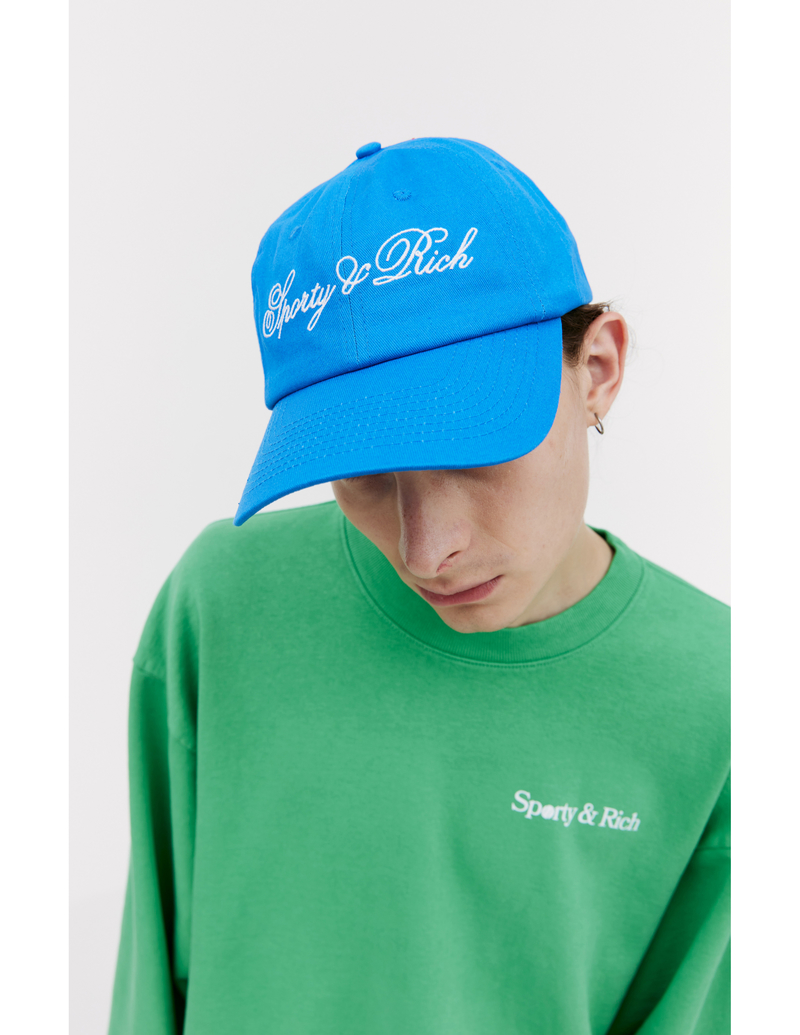 キャップ SPORTY & RICH CURSIVE LOGO HAT BLUE SPORTY & RICH Cursive logo cap - Blue | Garmentory